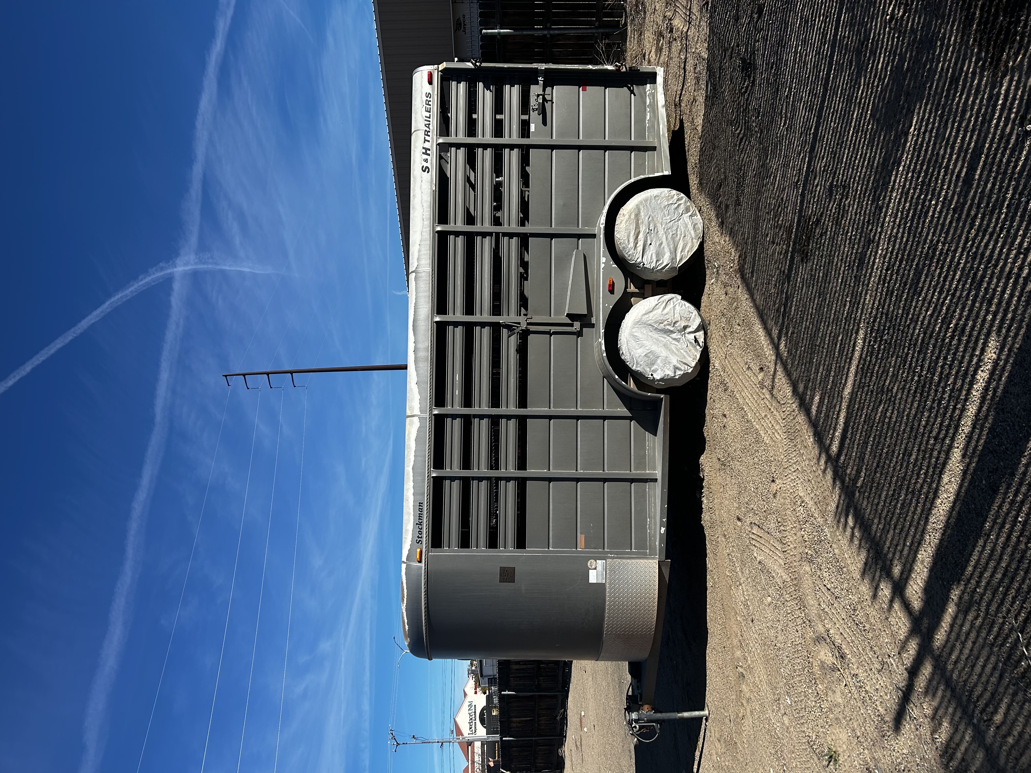 Grey S&H 16ft livestock trailer with ventilated sides for animal transport in Albuquerque
